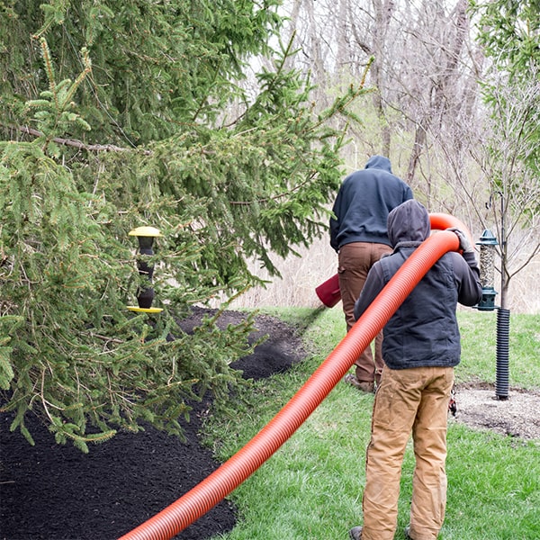 mulch blowing can reach areas that may be difficult to access with other methods